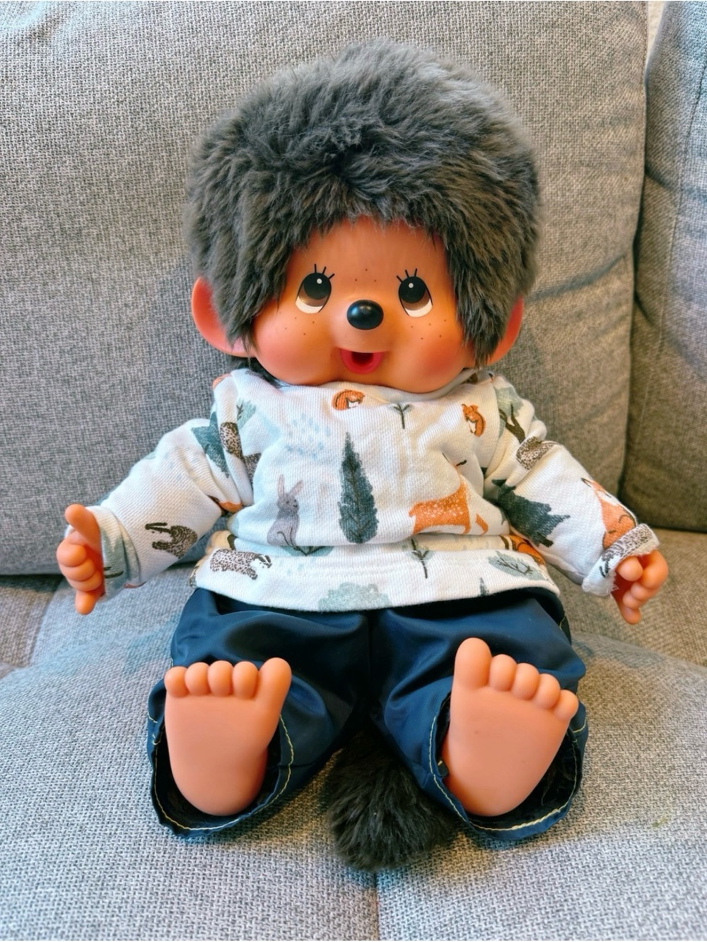 Monchhichi boy doll in sitting position
